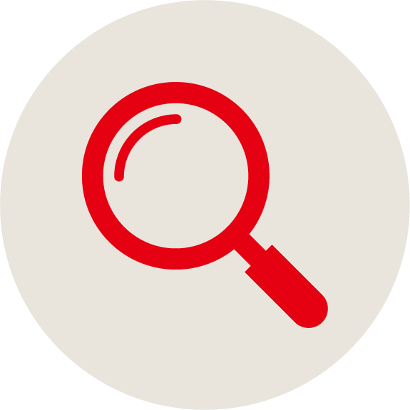 A red magnifying glass icon on a light beige circular background, symbolizing search or zoom function.