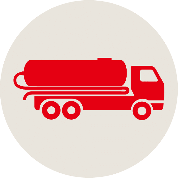 Red icon of a tanker truck with six wheels, viewed from the side, on a light beige circular background.